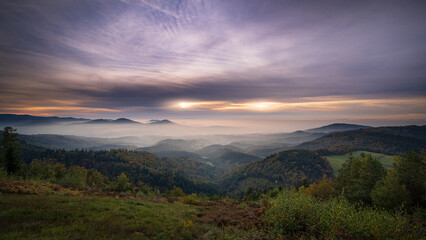Fototapeta na wymiar Double sun during sunset over the Murg valley covered with haze of fog