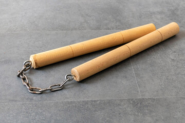 nunchaku, one of the close-up martial arts of the far east- nunchaku, made of handmade wood and chain,