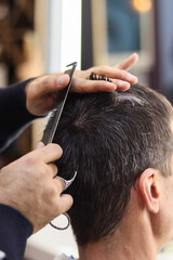 hairdresser cuts hair. men's haircut.haircut