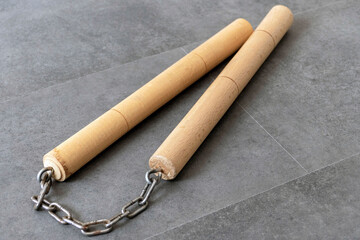 nunchaku, one of the close-up martial arts of the far east- nunchaku, made of handmade wood and chain,