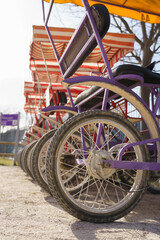 Fototapeta na wymiar Bike rental surrey or quadricycles for rent at Europe Park