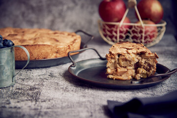Homemade apple pie on a vintage metal platter.