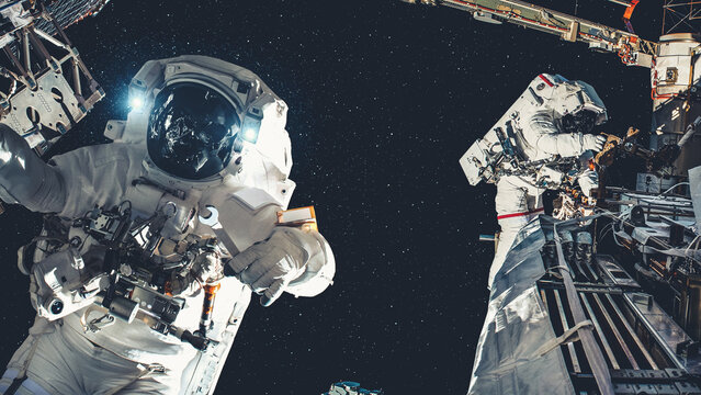 Astronaut spaceman do spacewalk while working for spaceflight mission at space station . Astronaut wear full spacesuit for operation . Elements of this image furnished by NASA space astronaut photos .