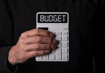 Budget word on calculator with dollars money. Photo