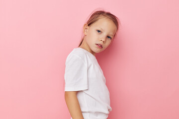Fototapeta premium Portrait of happy smiling child girl grimace posing fun isolated background