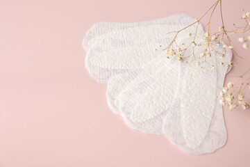 White sanitary pads, hygiene protection on a pink background. Gynecological menstrual cycle