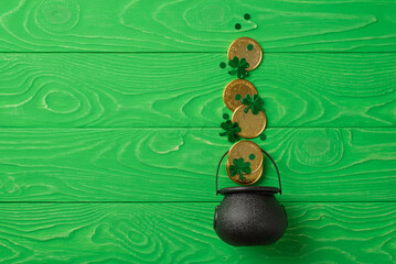 Top view photo of st patrick's day decorations green clovers confetti and gold coins flying out of...