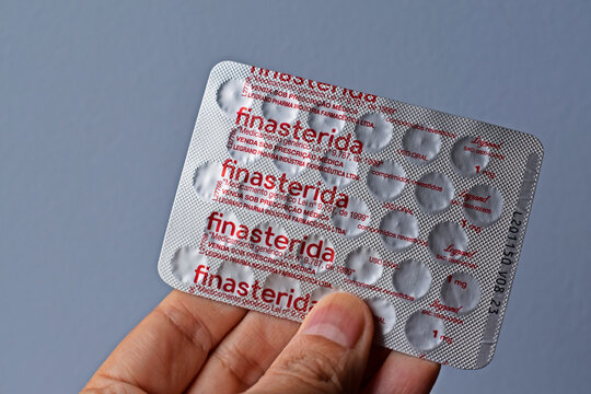 RIO DE JANEIRO, BRAZIL - FEBRUARY 19, 2022: Blister pack of finasteride pills on hand