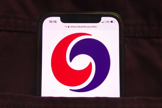 KONSKIE, POLAND - February 18, 2022: China Industrial Securities company logo on mobile phone hidden in jeans pocket
