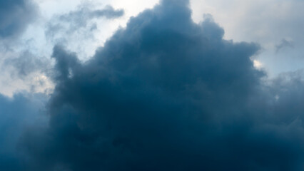 timelapse movement black storm clouds cover the sky. Scary black clouds during a hurricane and thunder. The weather is waiting for rain.