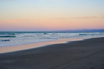 Fototapeta premium Sunset on Waiotahe Beach, a popular beach holiday destination near Opotiki, Bay of Plenty