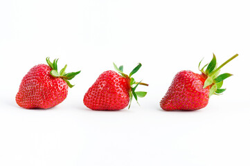 Strawberry isolated. Whole strawberries with leaf on white background. Full depth of field.