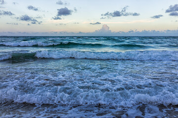 Naklejka na ściany i meble Hollywood Beach Miami, Florida Atlantic ocean stormy summer weather at dawn sunrise with blue hour sky in morning surf waves and nobody