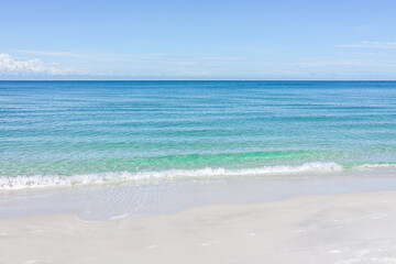 Barefoot beach in Southwest Naples, Florida with idyllic blue clear transparent water on empty summer day gulf of mexico coast horizon in paradise landscape