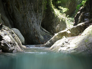 Fototapeta premium Sunny view of the landscape during a river tracing event