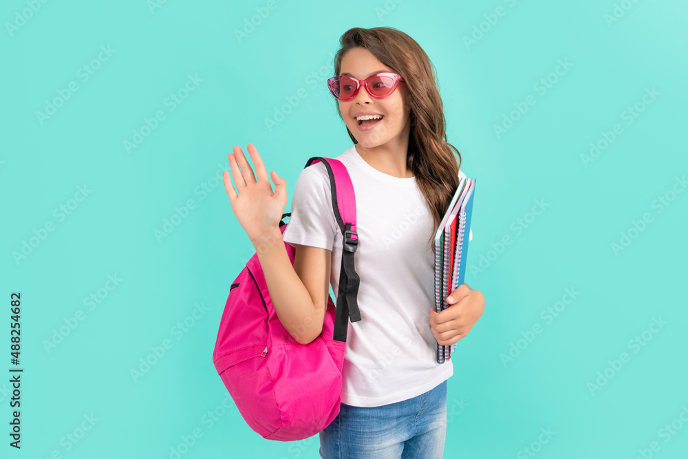 Canvas Prints happy teen girl with backpack and copybook ready to study at school waving hello, school