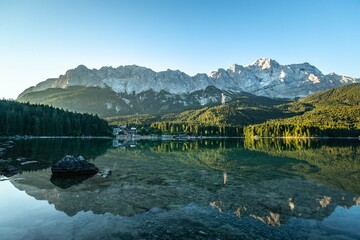 Sunrise reflections of the Alps in the Eibsee lake