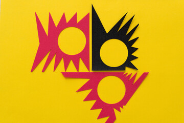 three irregular abstract shapes on yellow