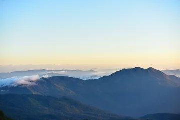 Fototapeten mountain peak at sunrise © tharathip