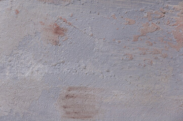 surface covered with decorative plaster with a chaotic pattern, multi-colored spots