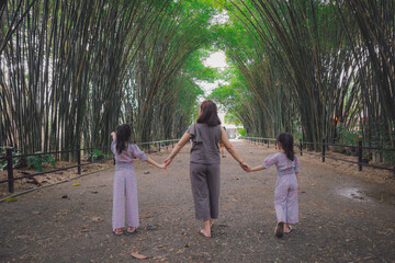 family in Bamboo tunnel of Wat Chulabhorn Wanaram Temple