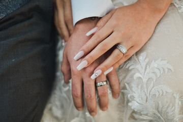 bride and groom holding hands