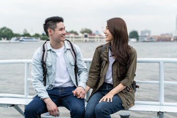 Asian attractive romantic couple travel in the city for honeymoon trip. 