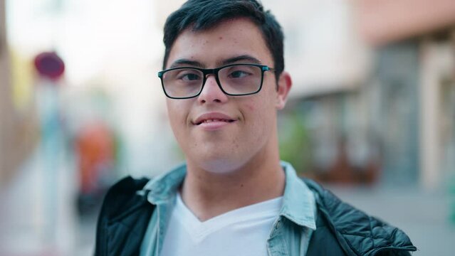 Down syndrome man smiling confident standing at street