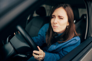 Woman Squinting and Driving Not Having Proper Visibility - obrazy, fototapety, plakaty