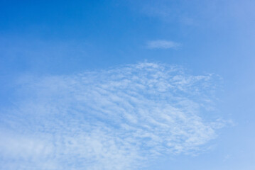 Blue sky and tiny white clouds for background.
