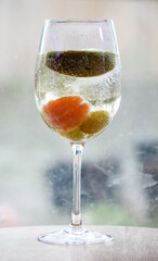 Champagne with fruit in a wine glass 