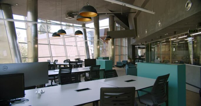 Office with stylish interior, panoramic window, comfortable furniture