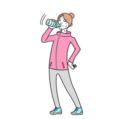 　A woman rehydrates after a workout. 