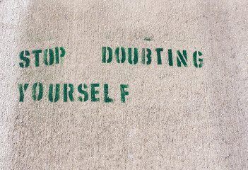 "Stop Doubting Yourself" Stenciled on Sidewalk	
