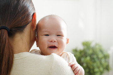 Portrait smiling Asian mother with her newborn baby