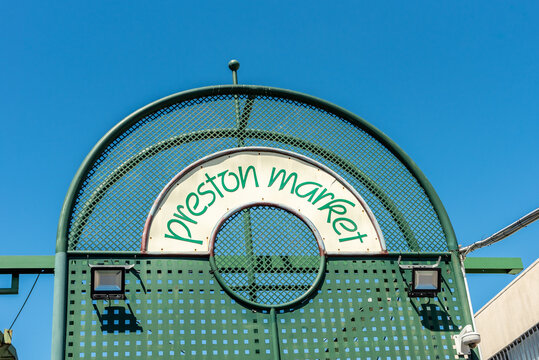 Melbourne, Victoria, Australia, February 6th, 2022: The green metal entrance sign to the Preston Market in Melbourne, Australia against a clear blue sky