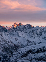 Naklejka premium Snowy Greater Caucasus ridge. Mount. Ushba. Sunset. Panoramic view. Elbrus region, Kabardino-Balkaria, Russia