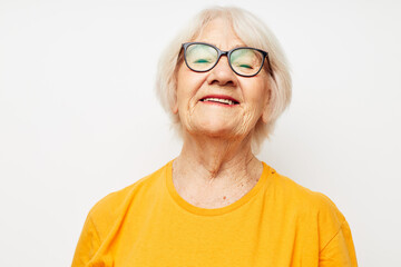 Photo of retired old lady health lifestyle eyeglasses treatment light background