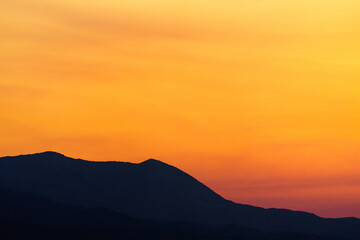 Afterglow in hilly terrain - Twilight with mountains in the foreground