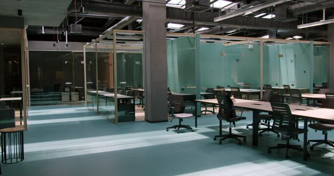 Modern corporate co-working with columns and glass partitions