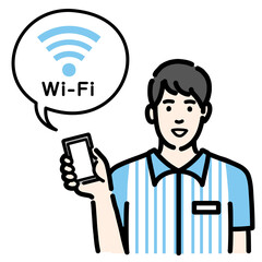 スマホを持ってWi-Fiの説明をしているコンビニ店員の若い男性
