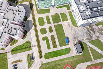 Obraz premium modern school complex in residential district. school courtyard with recreation area. aerial view.