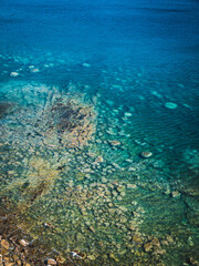 Obraz premium Sea surface with small waves, top view in blue and turquoise color tones