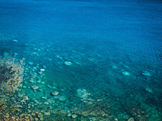 Naklejka na ściany i meble Sea surface with small waves, top view in blue and turquoise color tones