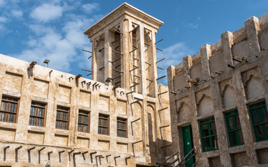 Tower in Souq Waqif with traditional middle eastern qatari architecture