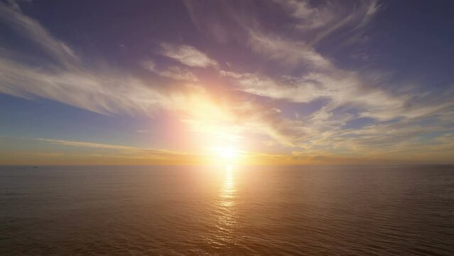 Time lapse video of sunset over the ocean in 4k
