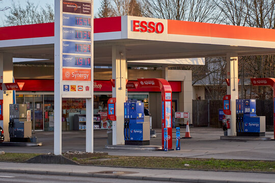 Price display in front of a Esso gas station (tankstelle) at dawn. High and expensive fuel prices in europe.