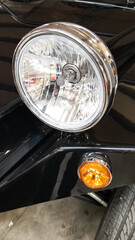 Classic retro car headlight of black vintage vehicle