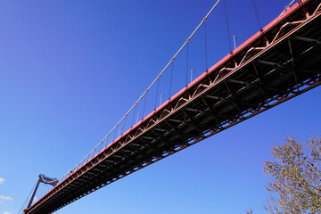 under the bridge Pont d'Aquitaine suspension bridge in bordeaux city river Garonne in south west France