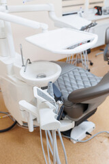 Modern stylish bright dental office with a new chair for receiving patients. selective focus